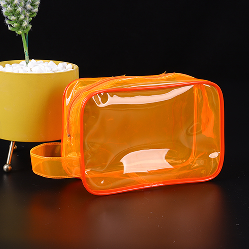 Neceser de PVC de color naranja translúcido